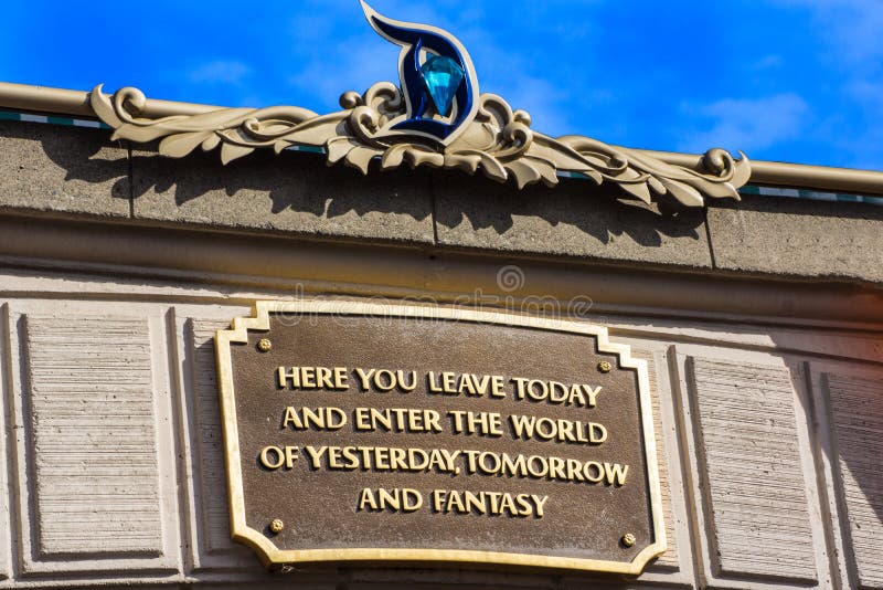 Disneyland, California, celebrating Disneyland`s 60th Diamond Anniversary. Entrance plaque is decorated for the big diamond celebration in 2015. Quote attributed to Walt Disney: Here you leave today and enter the world of yesterday, tomorrow and fantasy. Disneyland, California, celebrating Disneyland`s 60th Diamond Anniversary. Entrance plaque is decorated for the big diamond celebration in 2015. Quote attributed to Walt Disney: Here you leave today and enter the world of yesterday, tomorrow and fantasy.